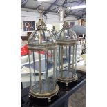 GARDEN LANTERNS, a pair, gilt metal frame with gilded domed top and ring handles.