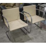 ARMCHAIRS, a pair, ivory stitched leather on tubular chrome frame.