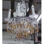 CHANDELIER, having six lights with round chrome frame and amber coloured faceted glass drops,