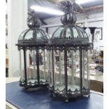 'CROWN TOP' CANDLE LANTERNS, a pair, 19th century styler, oval glass, lined metal fames, with hooks,