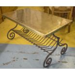 LOW TABLE, iron framed with a rectangular studded brass top on scrolled supports with a rack below,
