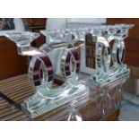 TABLE CANDLE HOLDERS, a pair, contemporary style, glass and silvered metal, 36cm H x 42cm W.