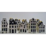 SET OF 16 NOVELTY DECANTERS MODELLED AS HOUSES EXCLUSIVELY MADE FOR KLM AIRLINES BY BOLS, AMSTERDAM