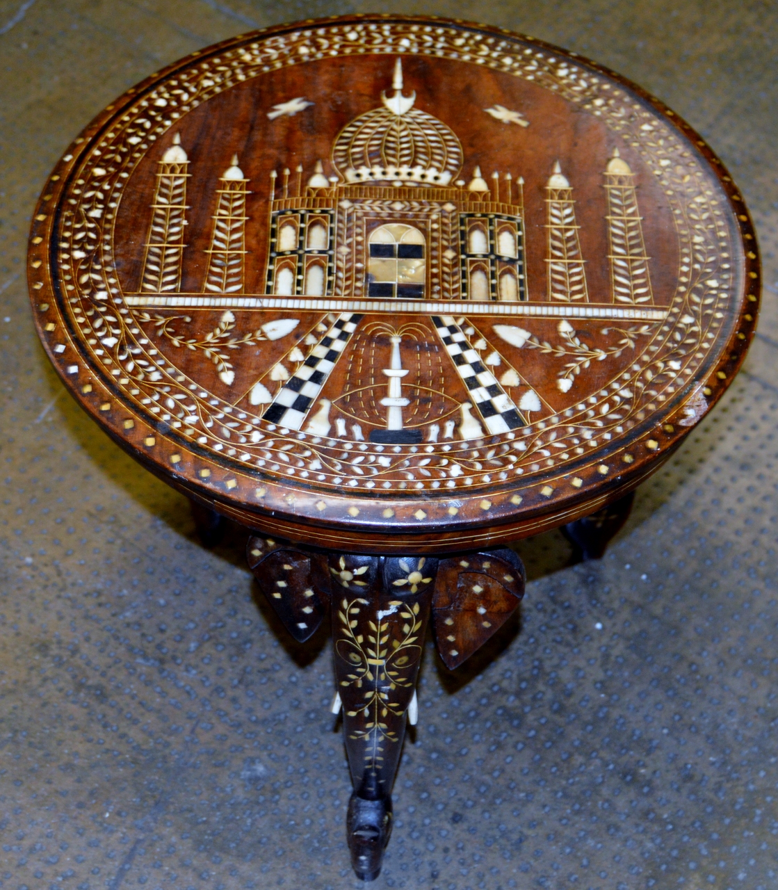 INDIAN DECORATIVE INLAID OCCASIONAL TABLE ON ELEPHANT SUPPORTS WITH GLASS PRESERVE