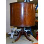 REPRODUCTION MAHOGANY DOUBLE DOOR DRINKS CABINET ON QUADRUPLE LEG BASE WITH BRASS CASTORS