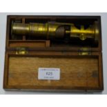 SMALL BRASS FINISHED MICROSCOPE WITH WOODEN CASE