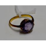 YELLOW METAL AMETHYST SET RING - WEIGHT = APPROXIMATELY 3.6 GRAMS