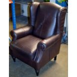 LARGE BROWN LEATHER WING BACK ARM CHAIR