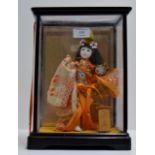 CASED ORIENTAL FIGURINE DISPLAY