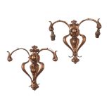 ENGLISH SCHOOL PAIR OF ART NOUVEAU ANODISED COPPER WALL LIGHTS, CIRCA 1910 each with leaf-clasped