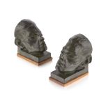 FRENCH SCHOOL PAIR OF PATINATED BRONZE BOOKENDS, CIRCA 1930 each cast as the head of a satyr, raised
