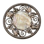 MANNER OF C. R. ASHBEE ARTS & CRAFTS WHITE METAL BELT BUCKLE, CIRCA 1910 of circular outline with