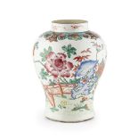 FAMILLE ROSE BALUSTER JAR QING DYNASTY, 19TH CENTURY the sides painted with a flowering fenced