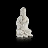 BLANC DE CHINE GUANYIN positioned seated with her hands gently tucked under the sleeves and robes