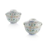 PAIR OF FAMILLE ROSE TEA BOWLS AND COVERS TONGZHI MARK BUT LATER finely painted with lotus flowers