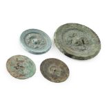 GROUP OF FOUR BRONZE MIRRORS four early bronze mirrors of various sizes, each with degrees of