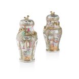 PAIR OF CANTON FAMILLE ROSE BALUSTER VASES AND COVERS QING DYNASTY, 19TH CENTURY painted in