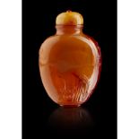 AMBER SNUFF BOTTLE QING DYNASTY, 19TH CENTURY of flattened ovoid shape, carved in low relief with