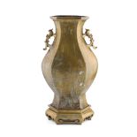 BRONZE VASE of hexagonal form with tall foot tapering to a flared body and slightly everted mouth,