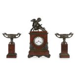 CHARLES X ROUGE MARBLE AND BRONZE CLOCK GARNITURE EARLY 19TH CENTURY the rectangular clock case