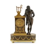 FRENCH EMPIRE GILT AND PATINATED BRONZE FIGURAL MANTEL TIMEPIECE EARLY 19TH CENTURY the gilt Roman