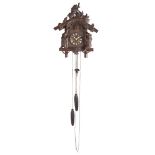 BLACK FOREST CARVED 'BEAR' CUCKOO CLOCK LATE 19TH/ EARLY 20TH CENTURY the pitched roof carved with a