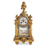 FRENCH GILT METAL AND PORCELAIN MOUNTED MANTEL CLOCK 19TH CENTURY the circular painted porcelain