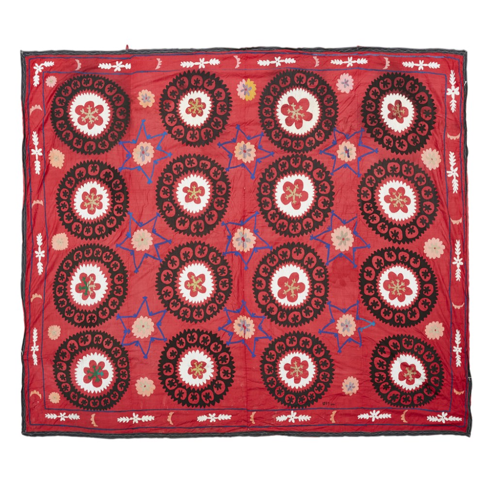 UZBEK SUZANI UZBEKISTAN, DATED 1977 the red field with allover brown and cream circular rosettes,