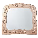 NEWLYN SCHOOL ARTS & CRAFTS COPPER WALL MIRROR, CIRCA 1900 shaped frame, repoussé-decorated with