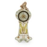 GERMAN ART NOUVEAU PORCELAIN MANTEL CLOCK, CIRCA 1900 the circular dial enclosed by shaped case