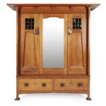 HARRIS LEBUS, LONDON ARTS & CRAFTS OAK TWO-PIECE BEDROOM SUITE, CIRCA 1900 comprising a WARDROBE,