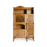 SHAPLAND & PETTER, BARNSTAPLE ARTS & CRAFTS OAK SECRETAIRE BOOKCASE, CIRCA 1900 the arched ledge