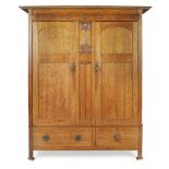 ENGLISH SCHOOL ARTS & CRAFTS OAK WARDROBE, CIRCA 1900 with twin doors each with tongue and groove