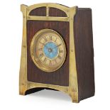AUSTRIAN SCHOOL SECESSIONIST STYLE OAK MANTEL CLOCK, EARLY 20TH CENTURY the shaped rectangular front