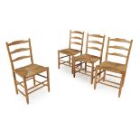 EDWARD GARDINER AFTER DESIGNS BY ERNEST GIMSON SET OF FOUR OAK 'CLISSETT' LOW BACK CHAIRS, CIRCA