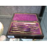 A Victorian rosewood cased drawing instrument set, 20.5cm wide