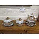 A Denby ware brown and white glaze part tea and dinner service including two tureens and covers