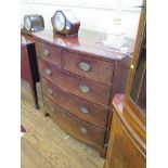 A Regency mahogany bowfront chest of drawers, with two short and three long graduated drawers on