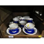 A set of six Royal Albert blue and gilt teacups and saucers, a Royal Worcester lidded pot and