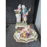 A Sitzendorf three foot shaped dish and cover, the cover applied with flowers and a cherub playing a