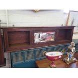 An Edwardian walnut narrow wall cabinet, with central bevelled mirror door, 111cm wide, 30cm high
