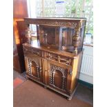 An oak court cupboard, with arcaded and linenfold panels, cup and cover supports, 20th century,