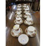 A set of eleven Royal Albert Old Country Roses pattern tea cups, saucers and plates, a jug and a