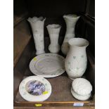 Four Belleek clover leaf vases, a decorative plate depicting peace, a lidded pot and a photograph