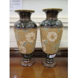 A pair of Doulton Lambeth vases, of tapering form with blue and white floral decoration, impressed