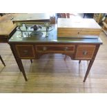 An Edwardian mahogany and satinwood crossbanded ladies writing desk, with three drawers on square