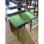 *A small mahogany foldover card table with undershelf and square tapering legs, 52cm wide