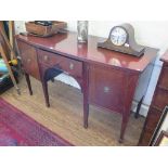 A George III mahogany bowfront sideboard, with central drawer flanked by cupboard doors on square