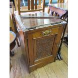 A late Victorian mahogany purdonium, now converted to a cupboard, with carved panels, as found