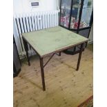 A 'Mudie's Squeezer Card Table' with reeded folding legs, labelled, 86cm square